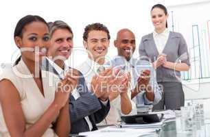 Happy business team applauding a good presentation