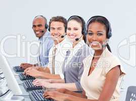 Multi-ethnic customer service representatives using headset