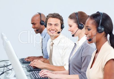 Cheerful business people with headset on