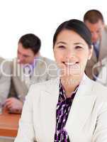 Smiling Asian businesswoman in a meeting