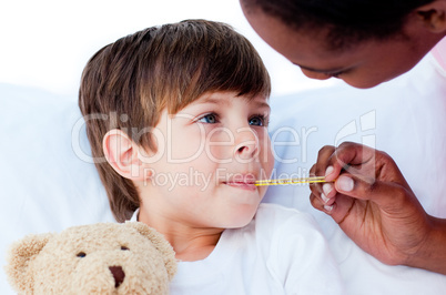Close-up of a doctor taking child's temperature