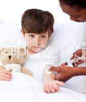 Sick little boy receiving an injection