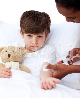 Adorable little boy receiving an injection