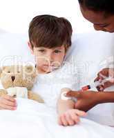 Adorable little boy receiving an injection