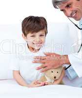 Smiling little boy attending a medical check-up