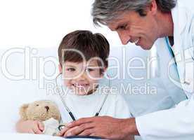 Cute Little boy playing with his doctor