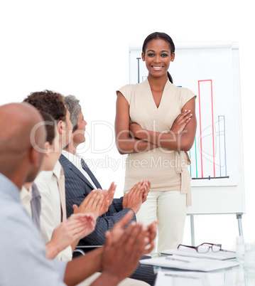 Positive business people applauding a presentation
