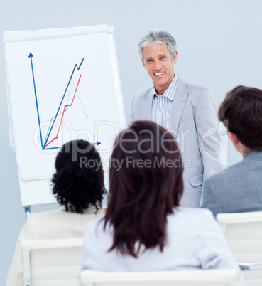 Mature businessman doing a presentation