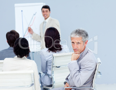 Confident businessman looking at the camera at a conference