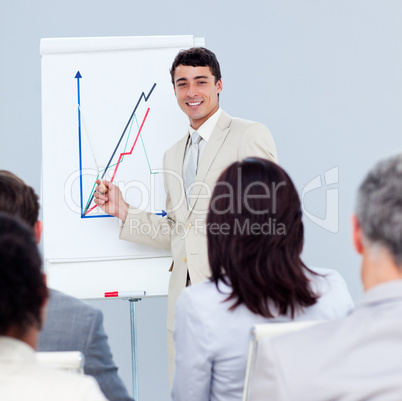 Positive young businessman doing a presentation