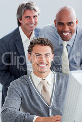 Charismatic business partners working at a computer