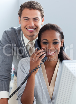 Charming business partners working at a computer
