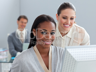 Self-assured business partners working at a computer