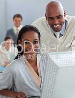 Assertive business partners working at a computer