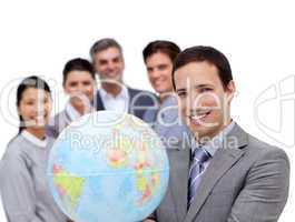 Victorious business team holding a terrestrial globe