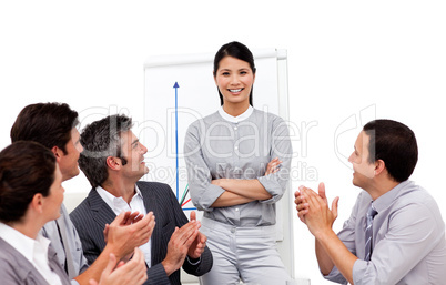 Successful businesswoman applauded for her presentation