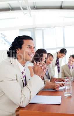 Portrait of a businessman and his team during a presentation