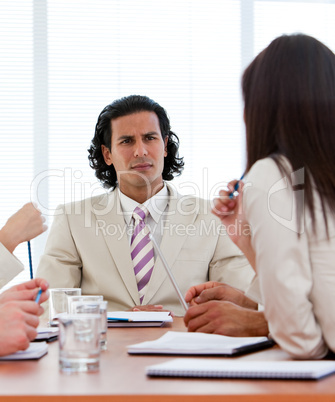 Concentrated manager talking with his team