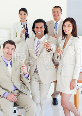 Confident business team celebrating a success