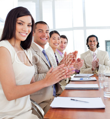 Multi-ethnic business team applauding after a conference