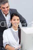 Smiling businesswoman helping by her manager
