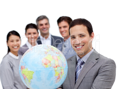 Victorious business team holding a terrestrial globe