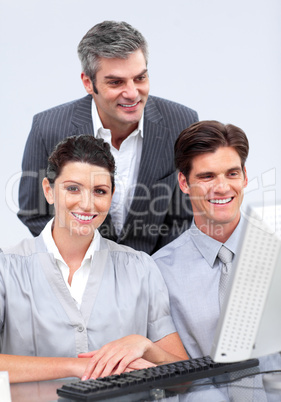 Charismatic businessteam working at a computer