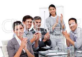 Enthusiastic businessteam applauding after a presentation