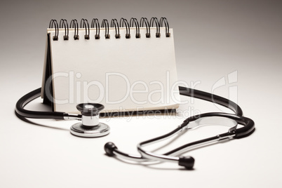 Blank Spiral Note Pad and Black Stethoscope