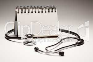 Blank Spiral Note Pad and Black Stethoscope