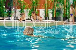 Family in swimming-pool