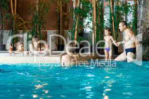 Family in swimming-pool