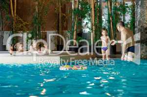 Family in swimming-pool