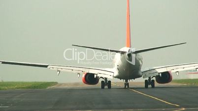 Commercial airliner  taxiing on runway