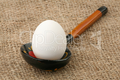 Egg in a wooden spoon