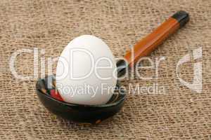 Egg in a wooden spoon