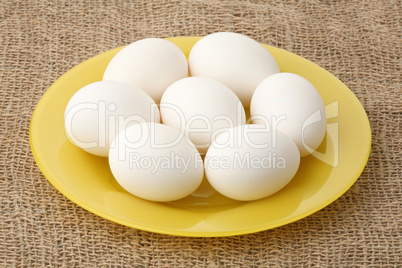 White eggs on a plate