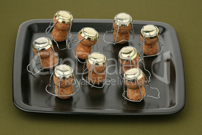 Nine stoppers and ceramic tray