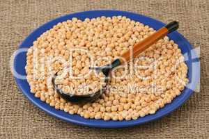 Dry peas and wooden spoon