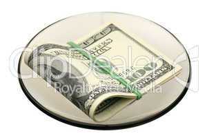 US dollars on a saucer
