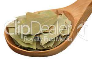 Bay leaf in a wooden spoon
