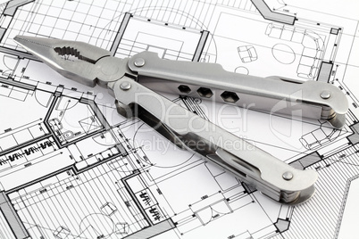 pliers and architectural plan
