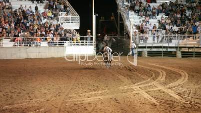 Rodeo woman barrel racing