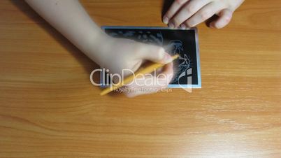 teenager is engraving. time lapse.