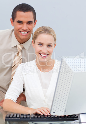 Two colleagues working at a computer