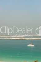 Beach and yacht of luxury hotel with a view on Palm Jumeirah man