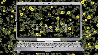 Laptop und Blumenmuster