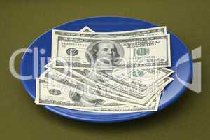 The American dollars in a blue plate
