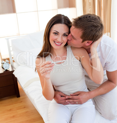 Attentive couple finding out results of a pregnancy test