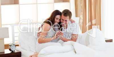 Merry couple finding out results of a pregnancy test